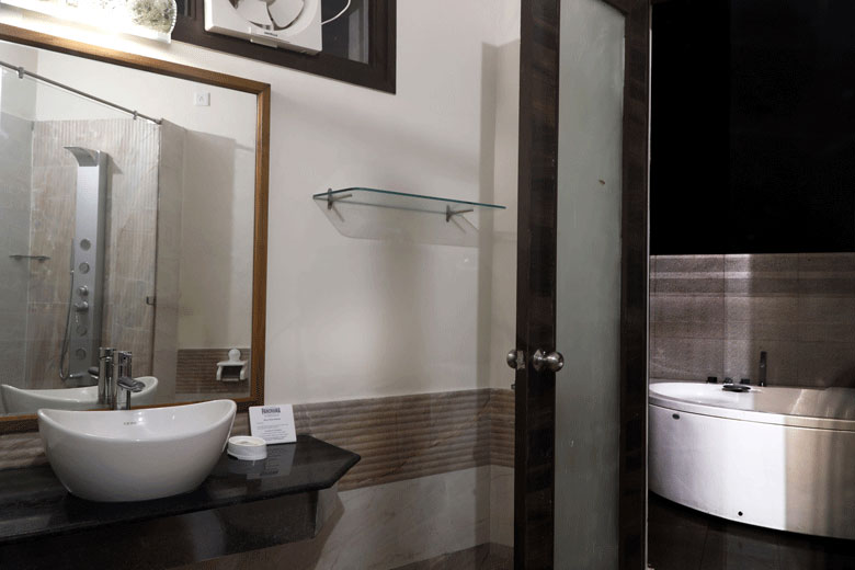 Bathroom with open to Sky Jacuzzi @ Corbett Panorama Resort